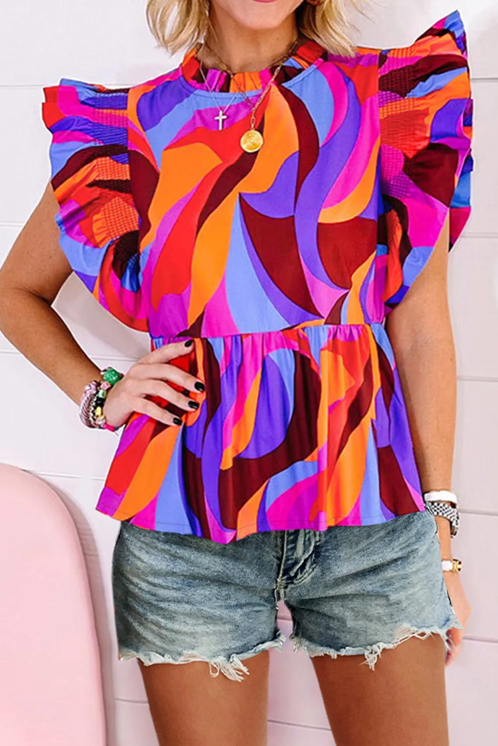 Blouse péplum orange à imprimé abstrait et manches flottantes